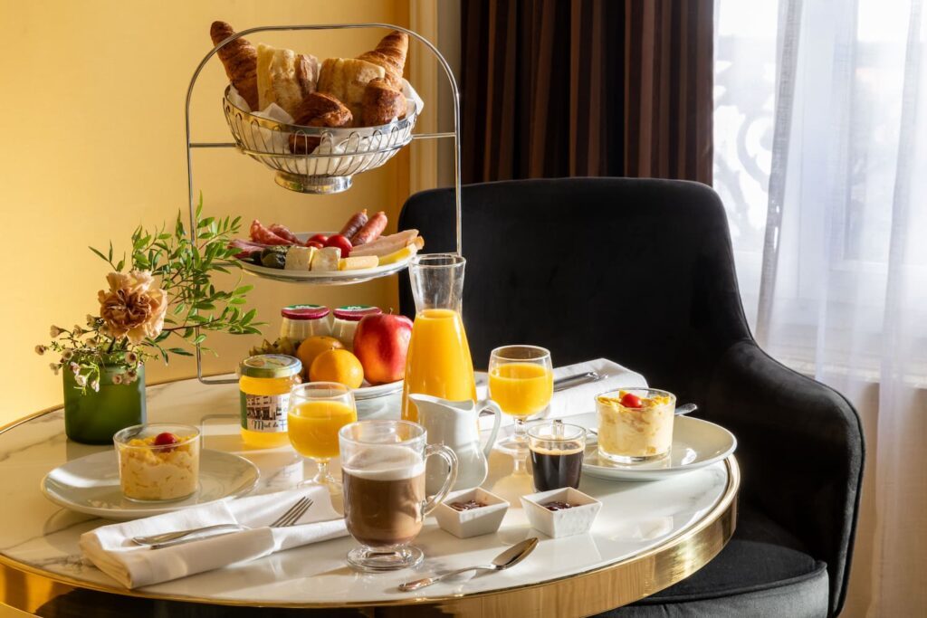 breakfast for two served in the room, on a marble table | hotel Paris city center | hotel des 2 Continents