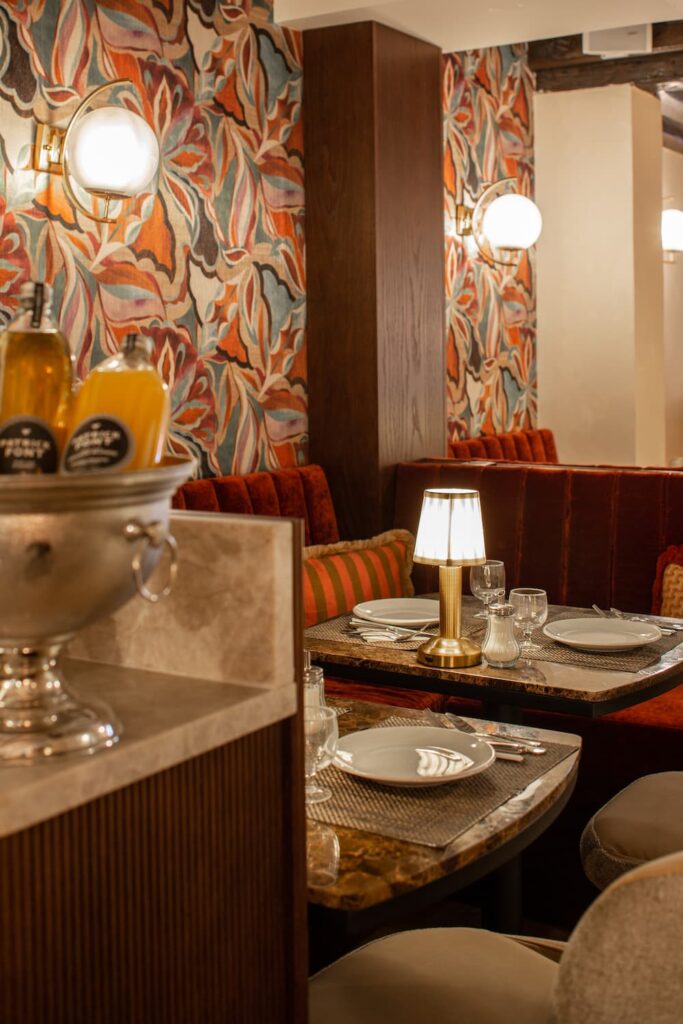 breakfast buffet with juice, table and lamp | hotel Paris city center | hotel des 2 Continents