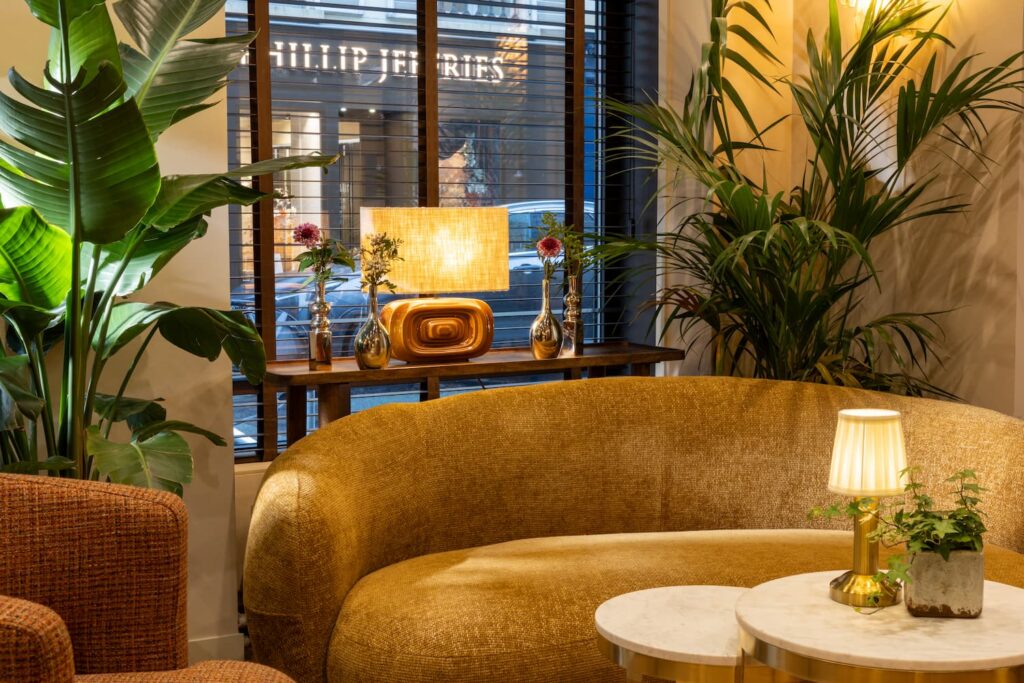 hotel in paris saint-germain-des-pres | lobby with sofa and light | hotel des 2 continents