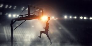 Basketteur sautant pour mettre le ballon dans le panier - JO Bercy basketball paris 2024