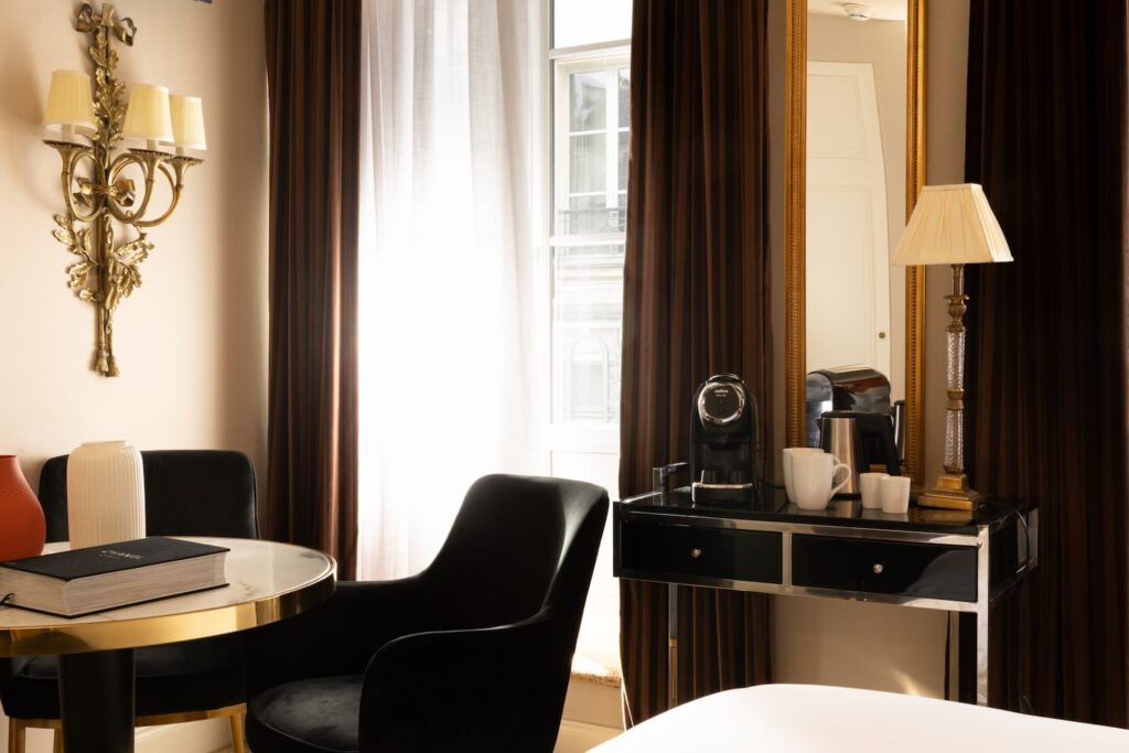 large window, brown curtains, black sit, table and expresso machine | romantic night in Paris and at the Hotel des 2 Continents